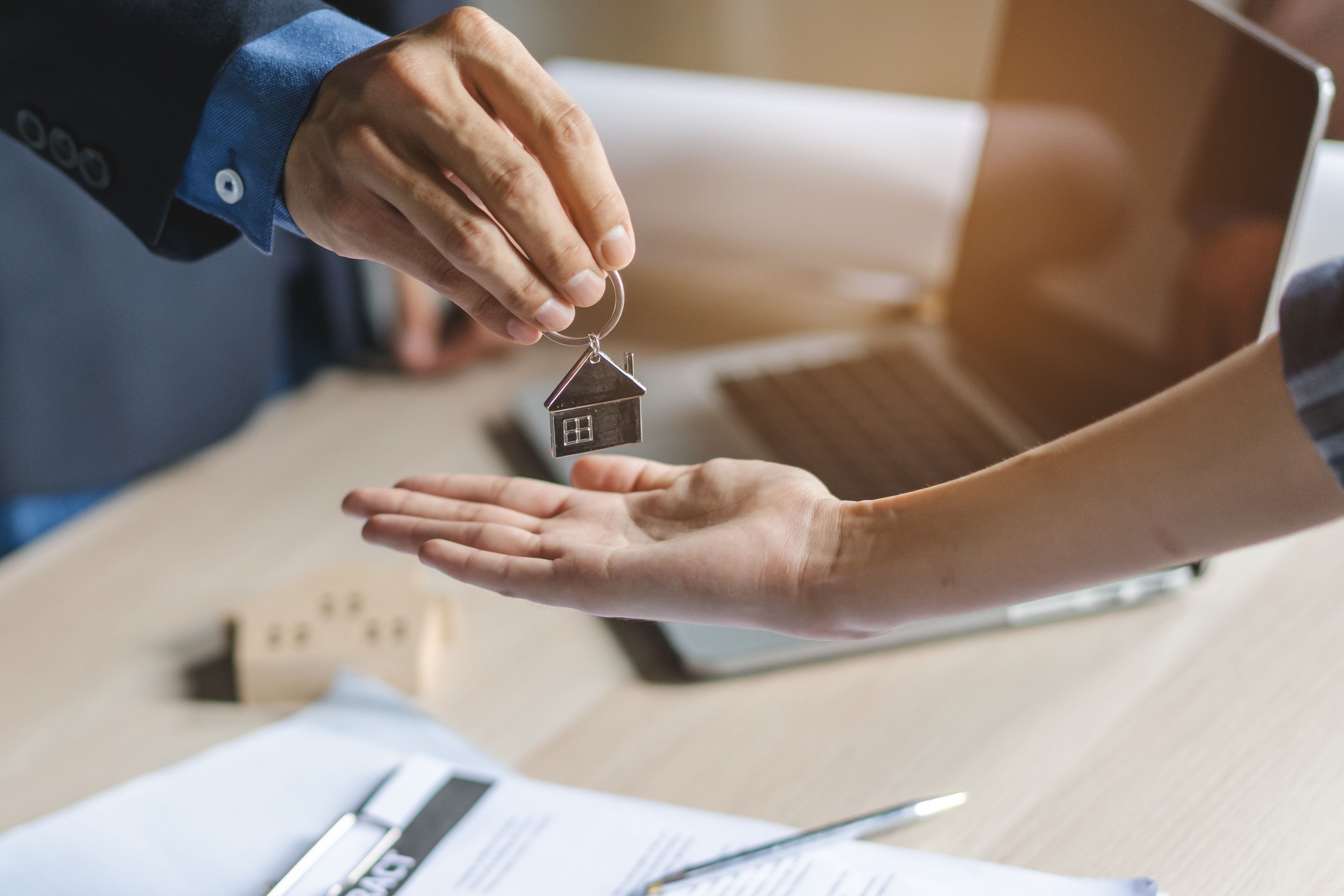 Agent Giving Key House To Buyer